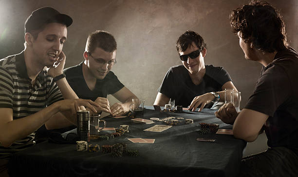 4 guys playing poker 4 guys playing poker child gambling chip gambling poker stock pictures, royalty-free photos & images