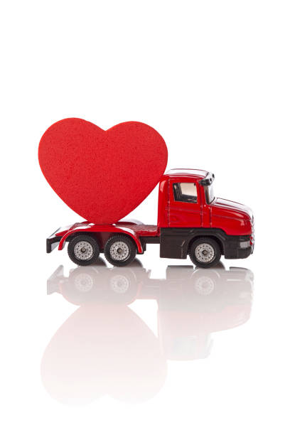 Toy truck with heart isolated on white background