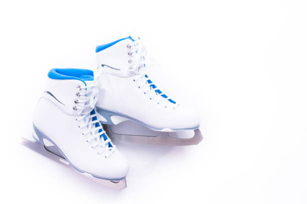 Ice skating on the ice rink arena with people, skating rink surface, ice skating in winter city, winter activities, holiday christmas time, with new year decoration and illumination, ice skates boots