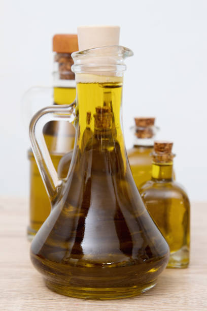 istock oil bottles grouped in white background, olive oil 1199639784