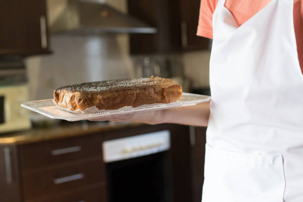 istock chef with freshly made pie on the tray in the foreground 1199639950