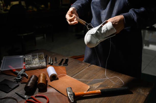 istock Men's shoes made of leather leather, the shoemaker workshop. shoemaker performs shoes 1199639979