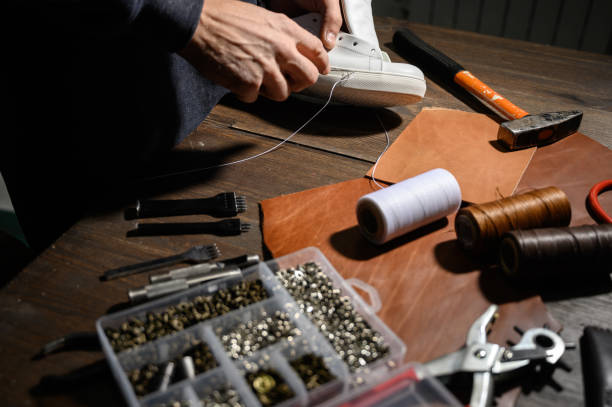 istock Men's shoes made of leather leather, the shoemaker workshop. shoemaker performs shoes 1199640047