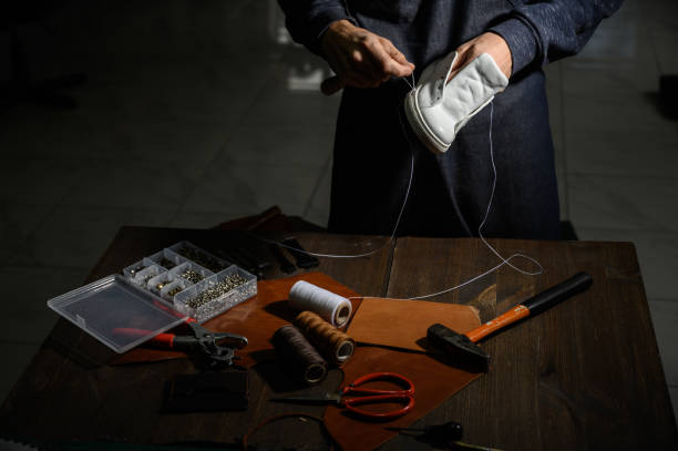 istock Men's shoes made of leather leather, the shoemaker workshop. shoemaker performs shoes 1199640054