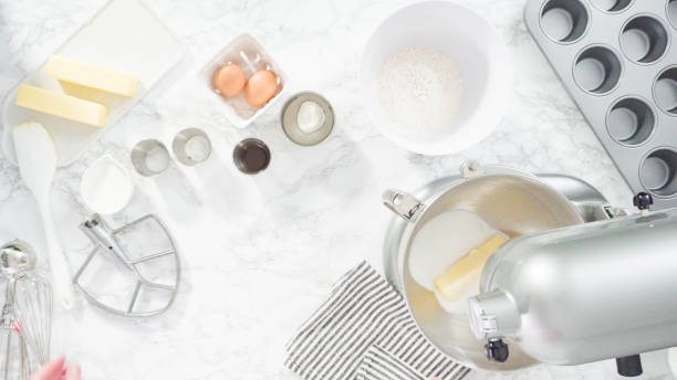 istock Mixing ingredients in kitchen mixer to bake mermaid theme vanilla cupcakes. 1199640083