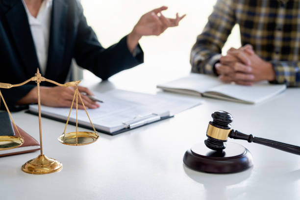 istock Midsection Of Lawyer And Client Discussing On Table 1199640359