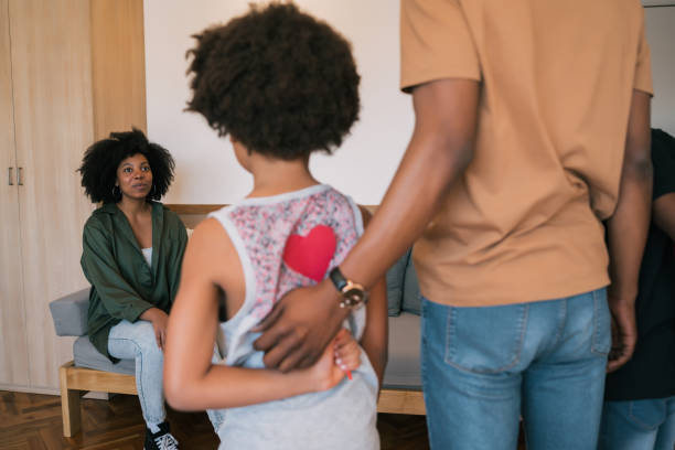 istock Little boys hiding gift for mom behind their back. 1199641769