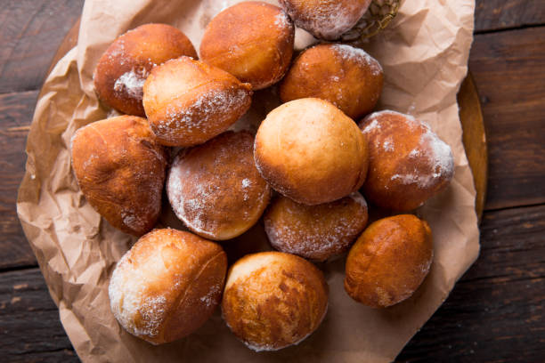 istock Bunuelos de viento - traditional Colombian sweet deep fried pastry. Spanish Easter doughnut. Mexican golden, crispy-sweet, tortilla-like fritters are sprinkled with sugar 1199642318