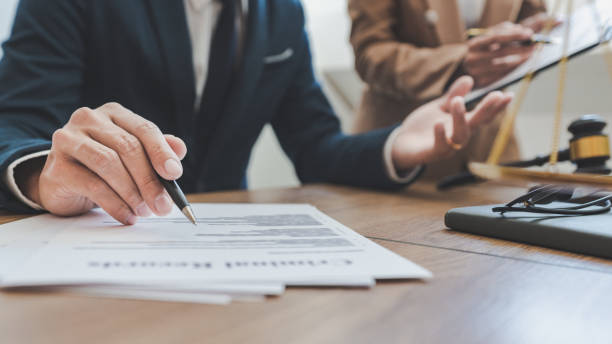 istock Midsection Of Lawyer Working On Table 1199642579