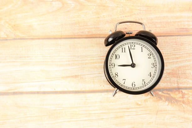 istock Time Punctuality Concept with black alarm clock. 1199643401