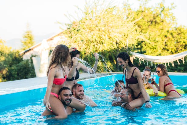 istock Friends at a poolside party 1199644659