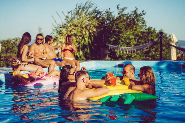 istock Friends at a poolside party 1199644818