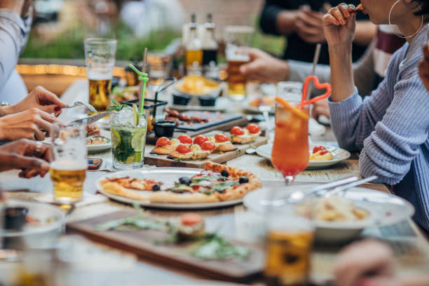 istock Friends eating in pub 1199646135