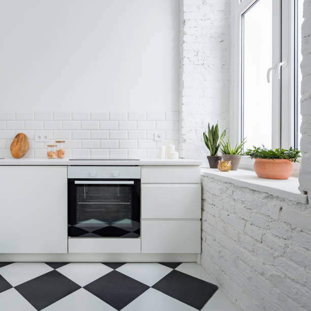 Small kitchen with brick wall Small kitchen with white brick wall and chess mosaic tiles sideboard photos stock pictures, royalty-free photos & images