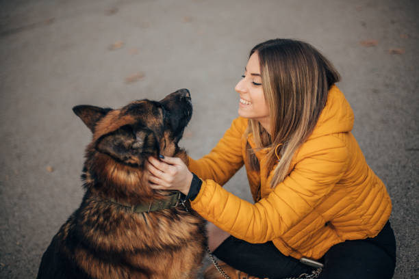 istock Young woman with dog 1199647141