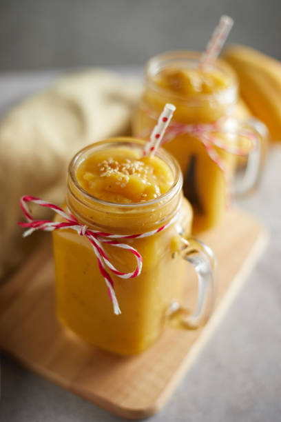 istock Refreshing and healthy mango smoothie in glasses. 1199648343