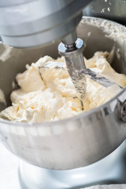 istock Making buttercream frosting for decorating a vanilla cake. 1199648385