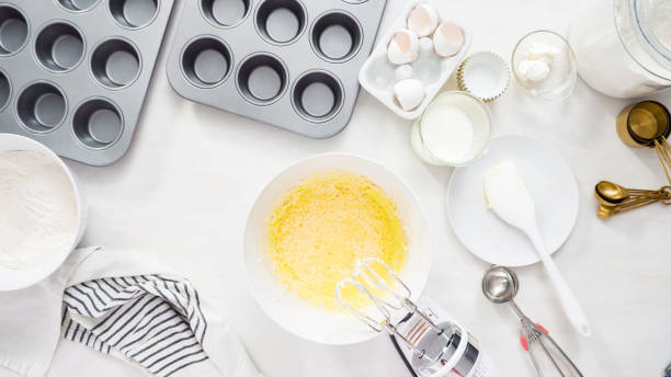 istock Mixing batter to bake vanilla cupcakes with buttercream frosting. 1199649042