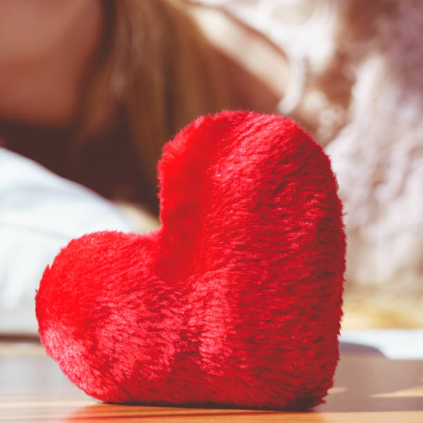 istock Close up of heart shaped red pillow 1199650234