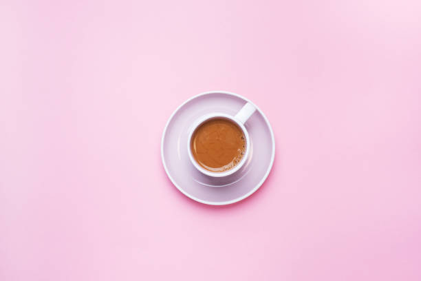 istock A Cup of coffee on a pink background with copy space. Top view. minimalism. 1199653555