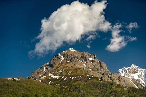 Beautiful landscape in the mountain view. Beautiful view of the mountains in the morning sun against the blue sky.