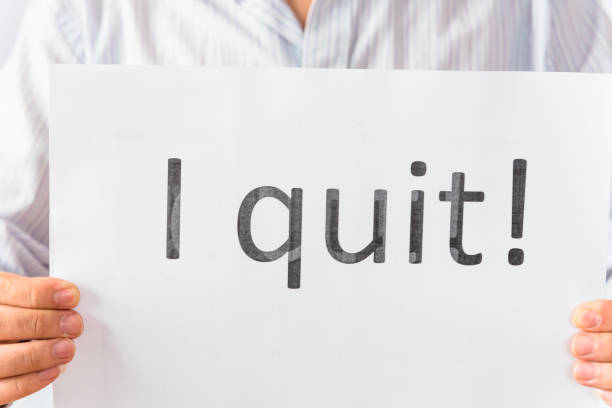 istock Studio shot Asian male hand showing paper with I Quit  text concept 1199654621