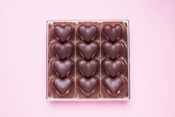 istock Concept Valentine's Day. Chocolate candies, hearts on a pink background 1199656482