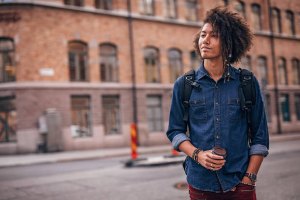 istock Hipster man drinking coffee in the city 1199658586