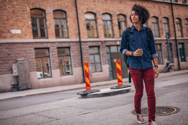 istock Hipster man drinking coffee in the city 1199658646