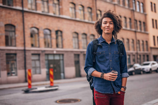 istock Hipster man drinking coffee in the city 1199658681