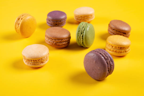 istock colorful macaroons on a yellow background 1199660442