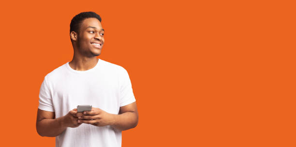 istock Happy afro guy looking at free space 1199661898
