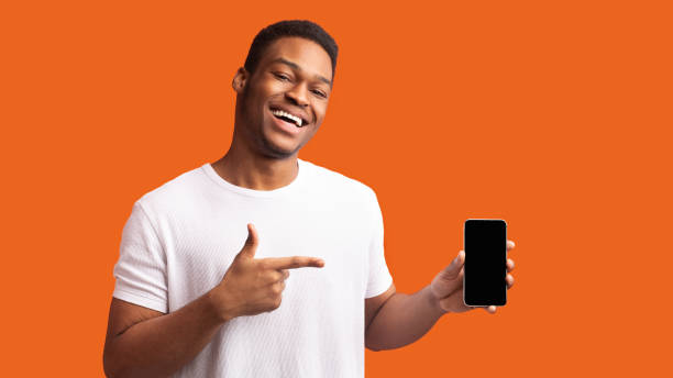 Afro guy showing blank black cellphone screen