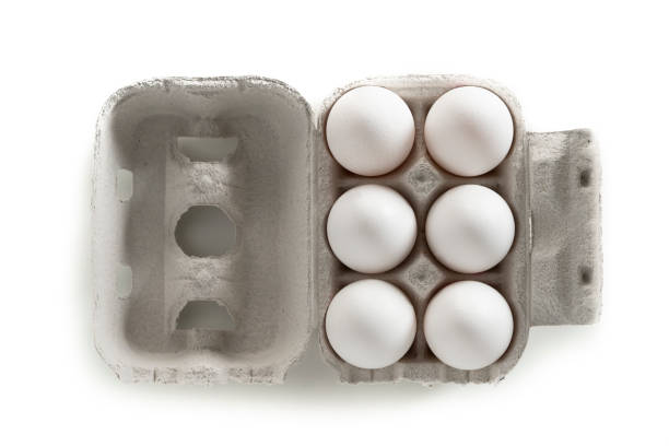 istock Six White eggs on cardboard box gray carton on white 1199662633
