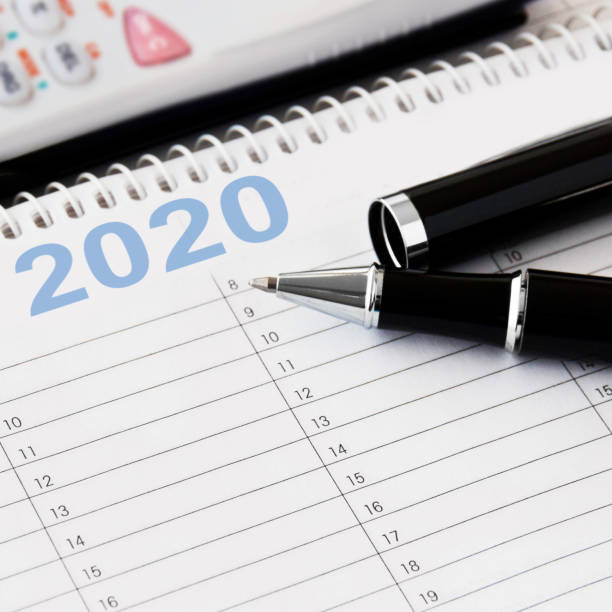 istock Calendar with pen and calculator background 2020 1199664502