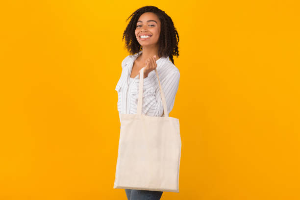 istock Black woman with blank eco sack for mock up 1199664993
