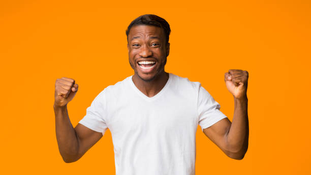 istock African American Guy Shouting Gesturing Yes On Orange Background, Panorama 1199665077