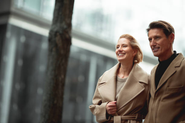 Fashionable couple Handsome couple is standing in the street and looking at the same spot in the distance. georgijevic frankfurt stock pictures, royalty-free photos & images
