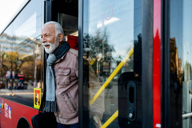 Senior Business Man Using Public Transportation - Bus