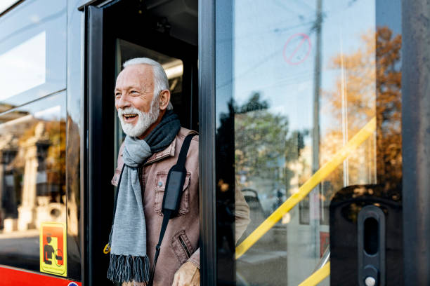 istock Senior Business Man Using Public Transportation - Bus 1199666674