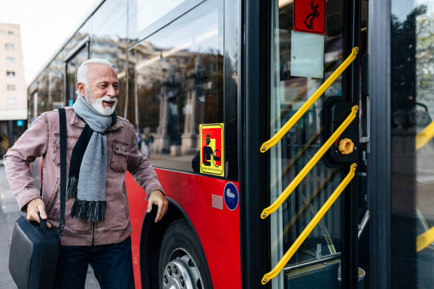 istock Senior Business Man Using Public Transportation - Bus 1199666784