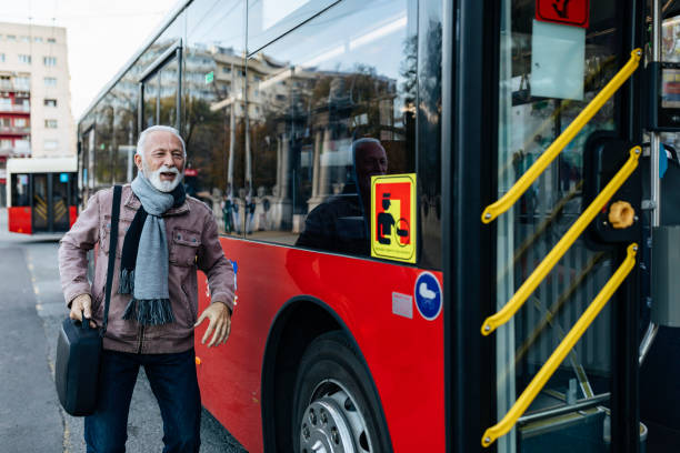 istock Senior Business Man Using Public Transportation - Bus 1199666827