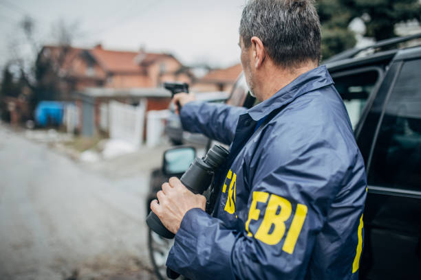 istock An FBI agent with a gun in his hand 1199667798