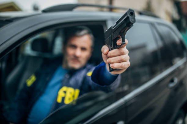 istock An FBI agent with a gun in his hand 1199667875