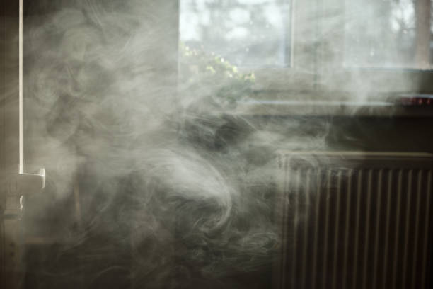 Kitchen Full Of Thick Vape Smoke A scenic view of a kitchen with full of dense vape smoke that is being backlit by the sunlight. steam photos stock pictures, royalty-free photos & images