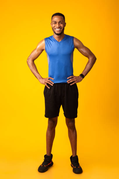 istock Full length image of smiling happy black fit guy 1199668487