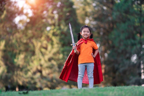istock Wonder Girl Holding a Sword 1199669889