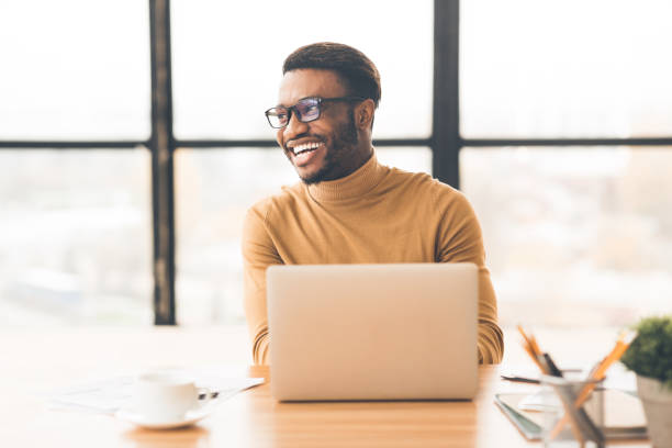 istock Headshot of handsome black guy looking aside 1199669962
