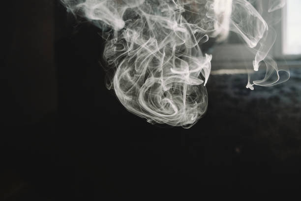 istock Thick Wispy Vape Smoke In The Morning Light Close-Up 1199670391