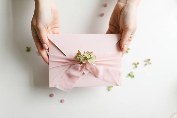 istock Beautiful light pink holiday card in envelope 1199671920